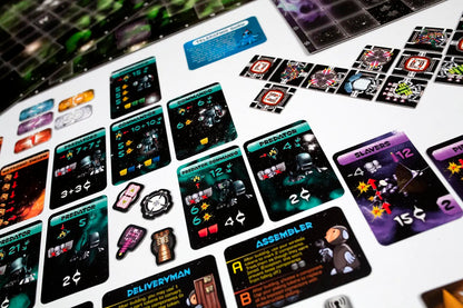 A close-up of numerous colorful sci-fi board game cards, tokens, and a galactic game board laid out