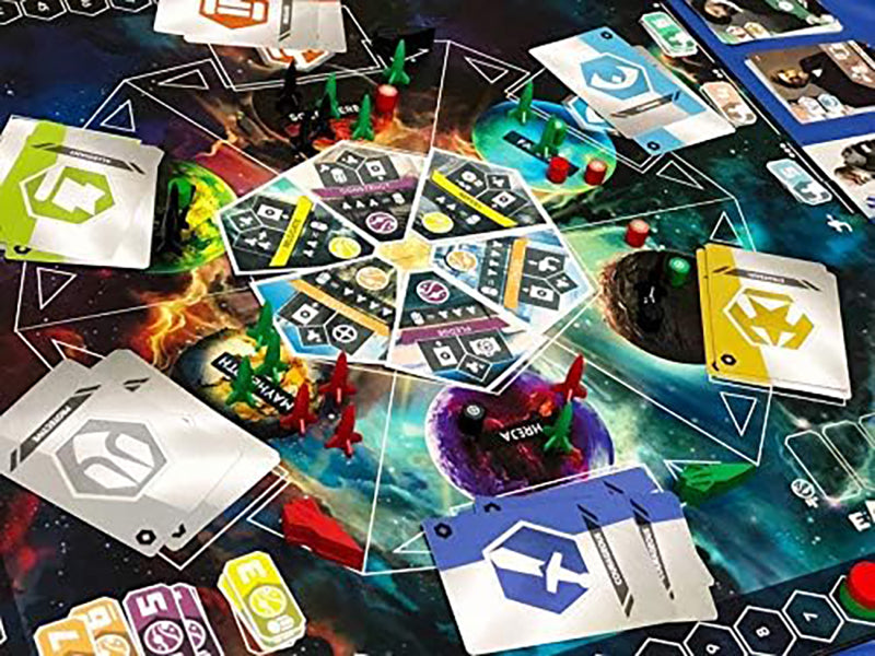 A colourful space-themed board game laid out, featuring cards, spaceship tokens, and cosmic artwork