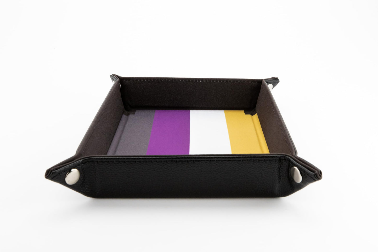Nonbinary velvet dice tray snapped into shape, featuring the flag colors dark gray purple white and yellow inside a black textured exterior