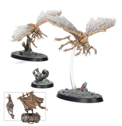 Two large insectoid flying miniatures with veined wings and clawed limbs, displayed on rocky terrain bases