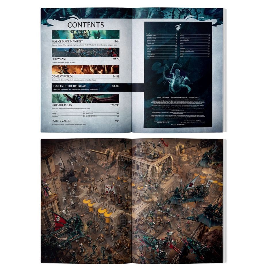 Open rulebook showing the Table of Contents and a detailed double-page spread of Drukhari tabletop miniatures in battle