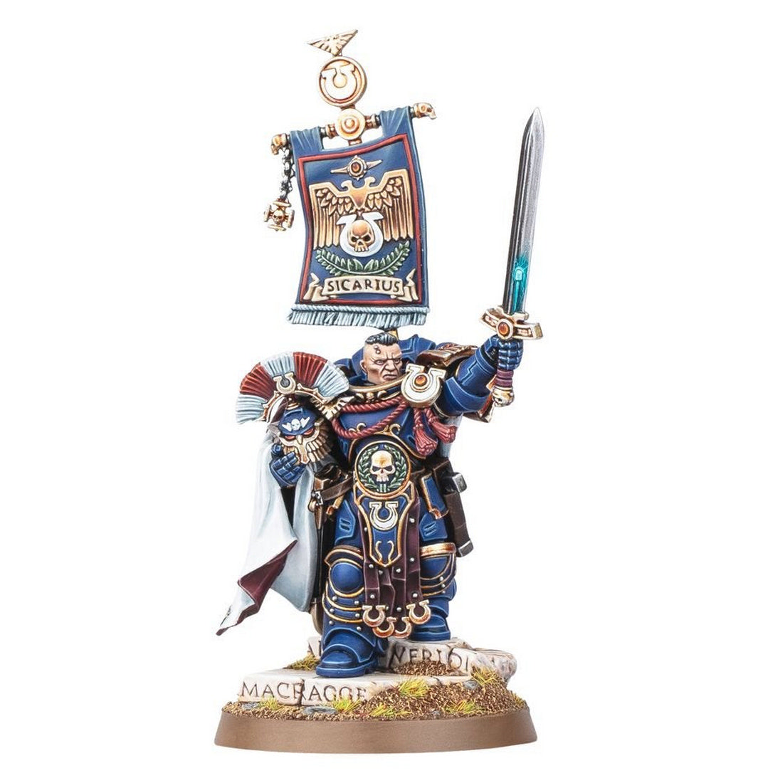 Painted miniature of Ultramarines Captain Sicarius in blue armor, raising a power sword and holding a banner