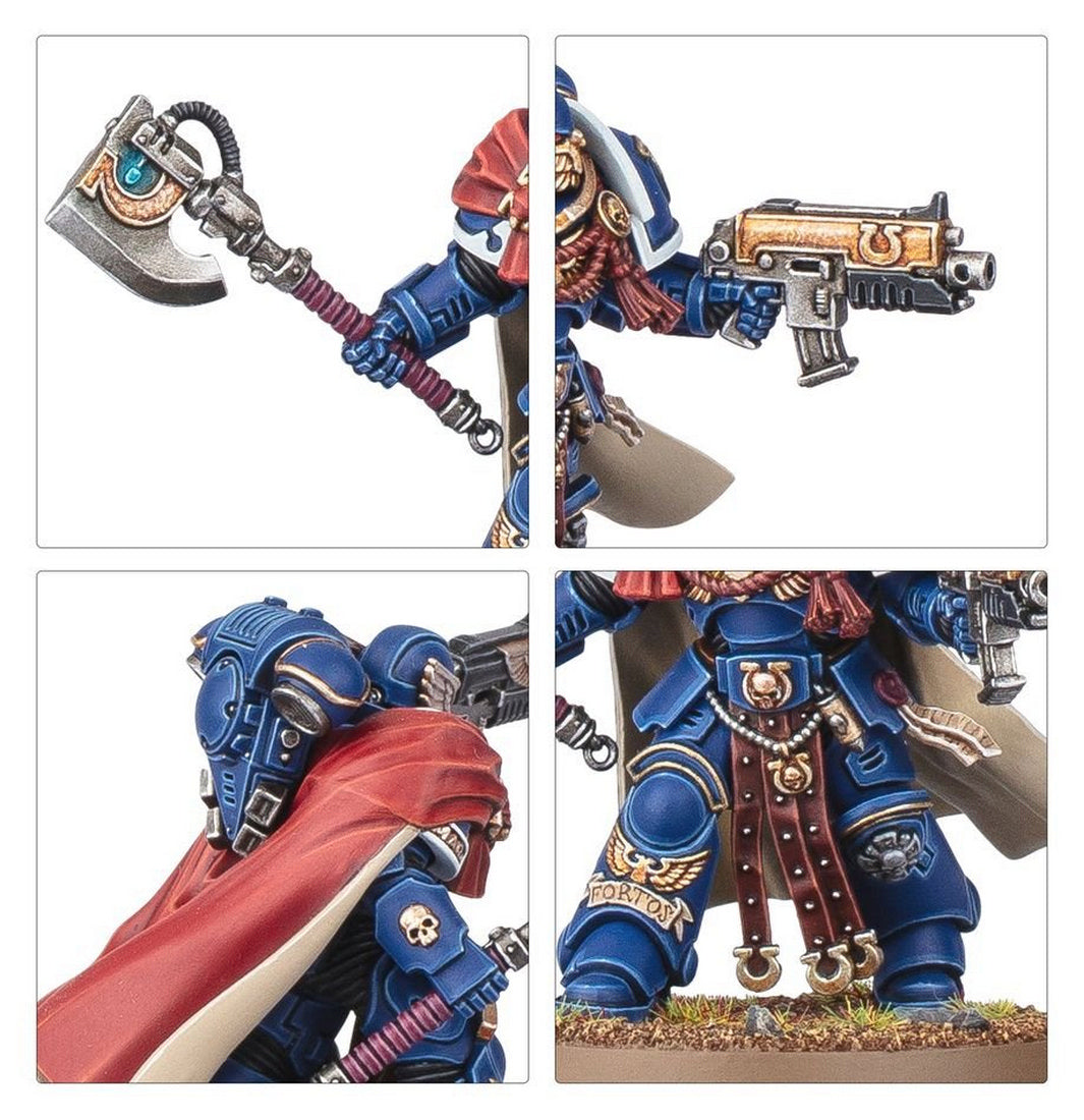 Detailed miniature of a blue armored Space Marine Captain with a red cloak, power axe, and pistol
