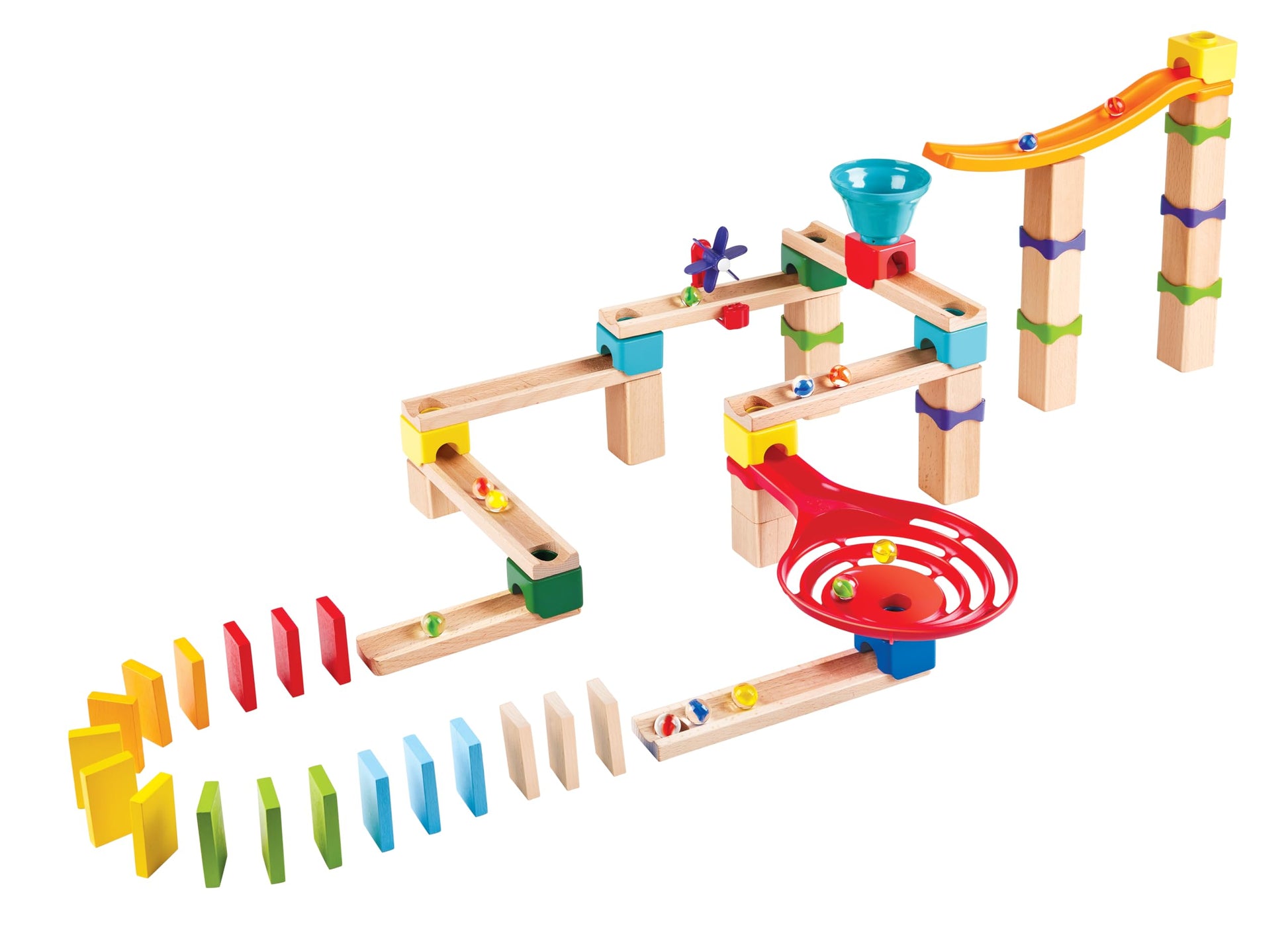Detailed view of a wooden marble run set with plastic tracks funnel spiral catcher moving marbles and a line of rainbow dominoes