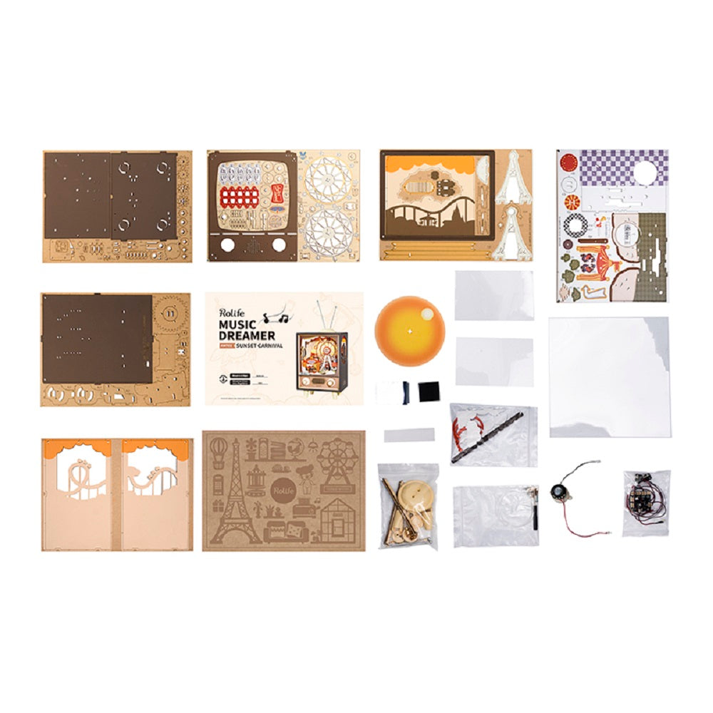 Layout of the Music Box Sunset Carnival kit with laser-cut wood parts for the vintage television frame and internal Ferris wheel, plus a speaker and various electrical components