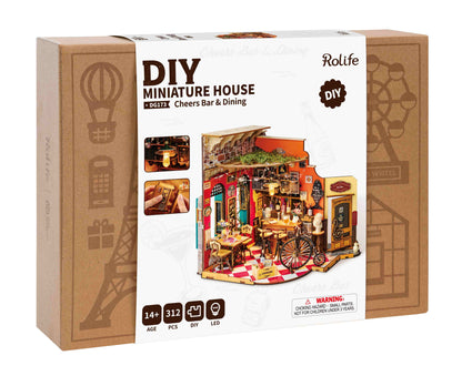 The Rolife DIY Miniature House Cheers Bar and Dining kit box displays the finished 312-piece model with detailed interior furnishings and LED lighting