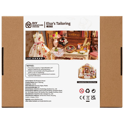 The brown boxed DIY Miniature House Elsa's Tailoring kit shows a finished scene of a detailed sewing shop featuring a floral dress and an assembled dimension of 238x165x175mm
