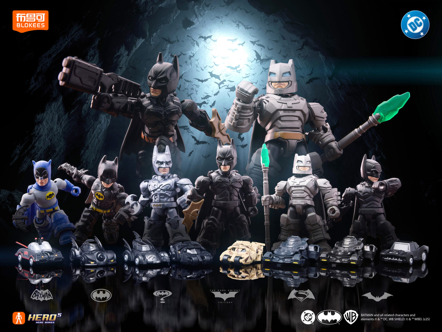 A display of various Batman action figures and miniature Batmobiles against a dark, bat-filled cave background