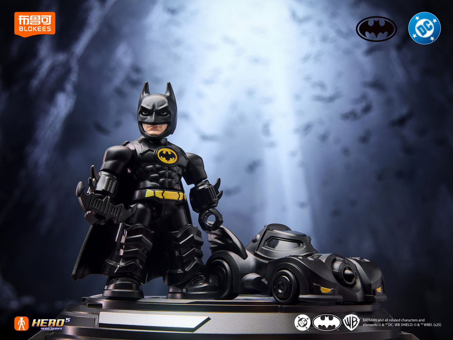Stylized Batman figure standing beside a black Batmobile toy on a display base in a moody, dark setting