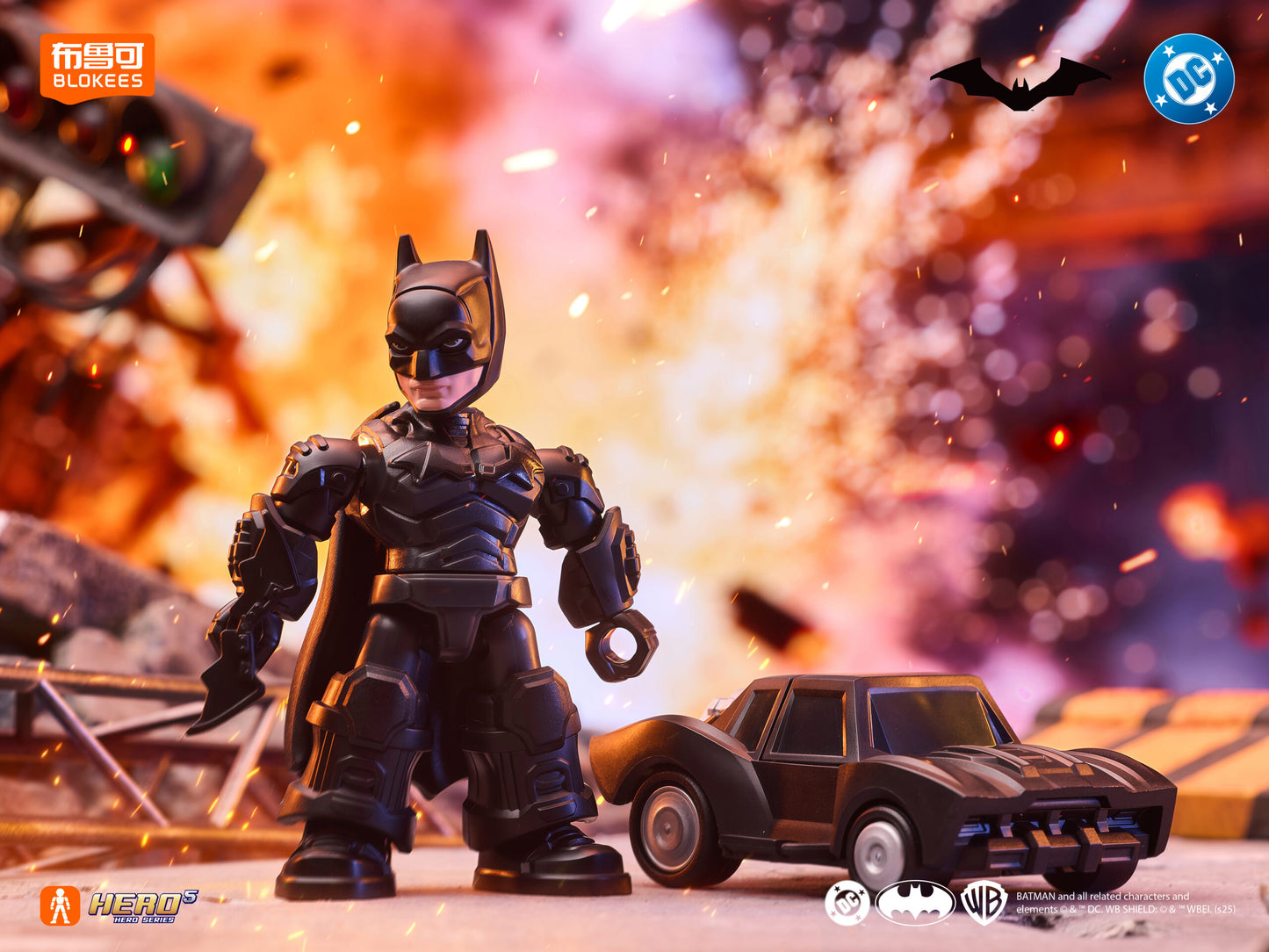 Stylized Batman action figure and Batmobile miniature standing before a massive fiery explosion