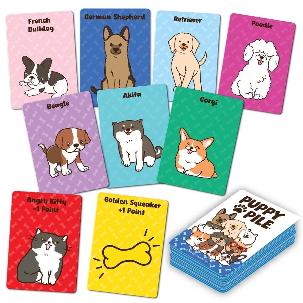 Colourful Puppy Pile card game cards scattered, featuring cartoon illustrations of popular dog breeds (Corgi, Poodle, Beagle) and special kitty cards