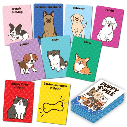 Colourful Puppy Pile card game cards scattered, featuring cartoon illustrations of popular dog breeds (Corgi, Poodle, Beagle) and special kitty cards