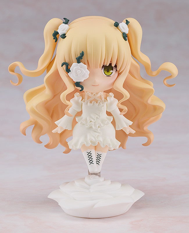 Figure of a girl with long blonde pigtails white dress and rose eye patch standing on a rose-shaped base on color background