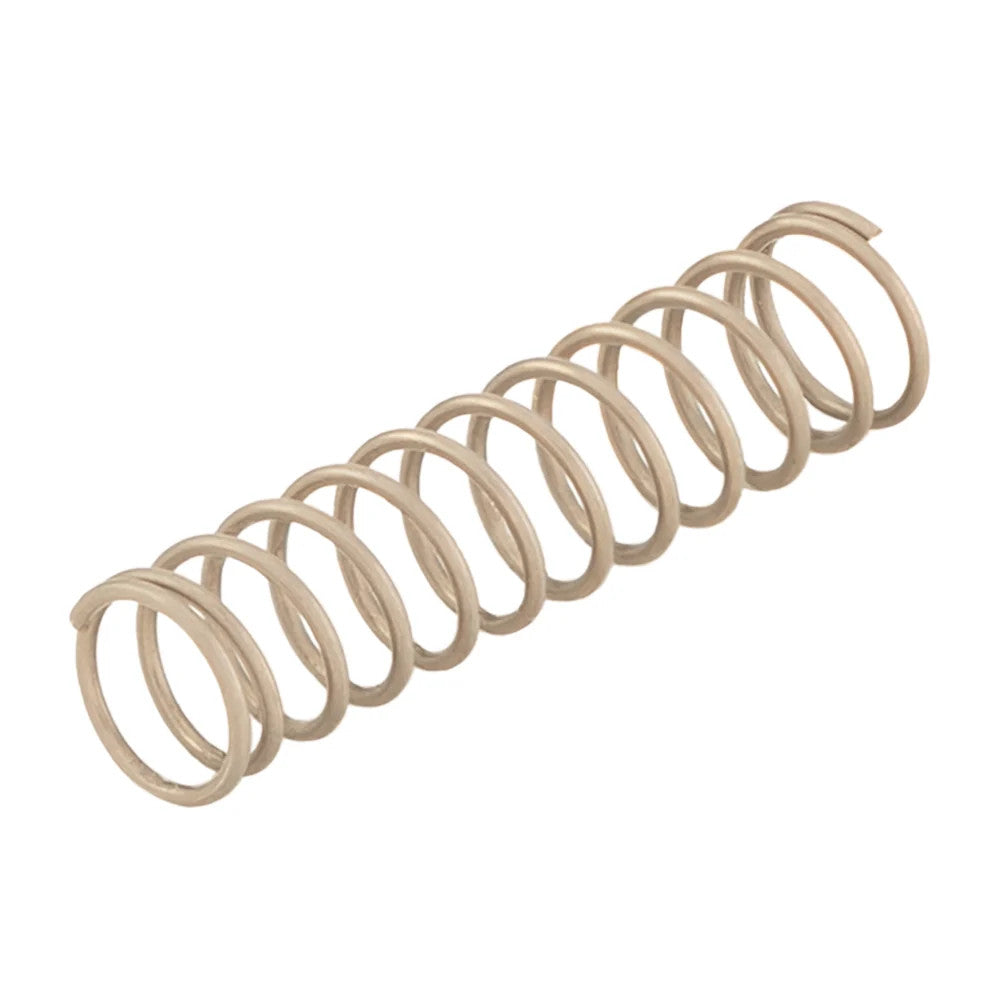A light beige metal coil spring angled on a white background.