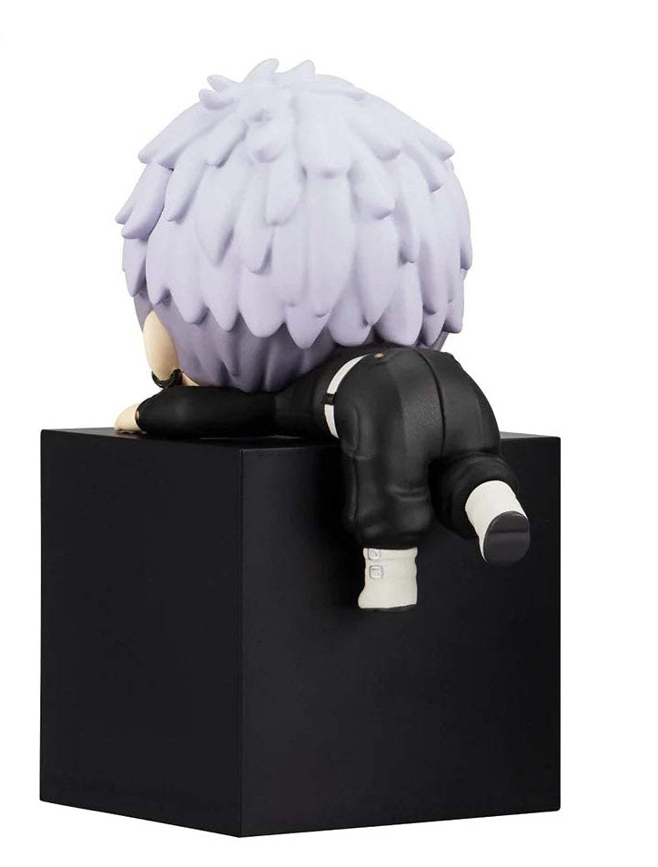 Takashi Mitsuya chibi figure leaning on a block, with crossed arms and serious face