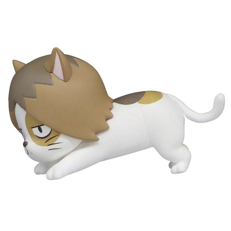 White cat toy figure with brown and yellow patches and brown hair-like design on its head