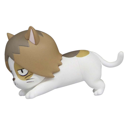 White cat toy figure with brown and yellow patches and brown hair-like design on its head