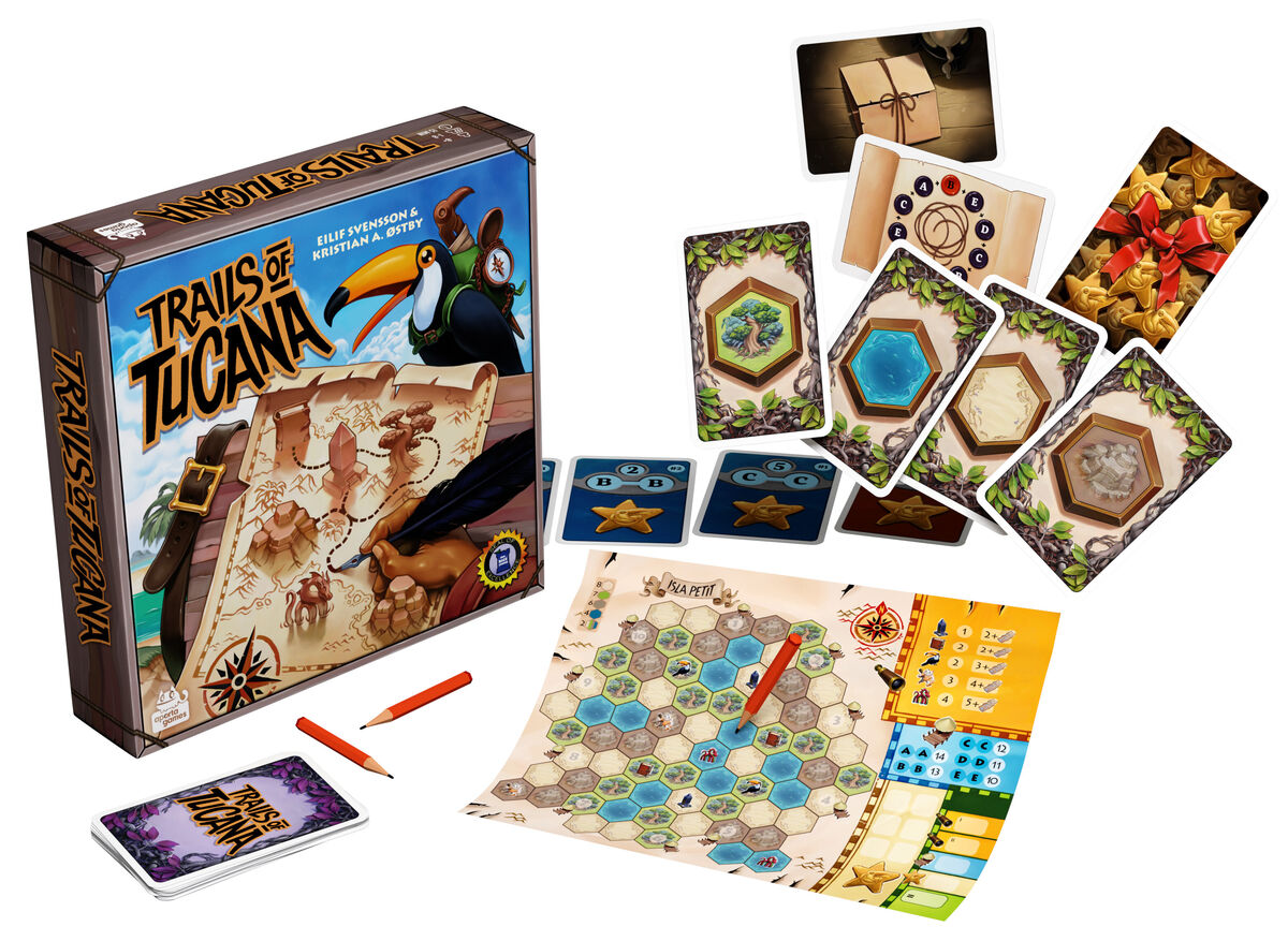 Trails of Tucana board game components including the box, a hexagonal map board with a pencil, various cards with land features, and small star tokens