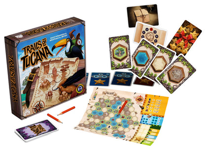 Trails of Tucana board game components including the box, a hexagonal map board with a pencil, various cards with land features, and small star tokens