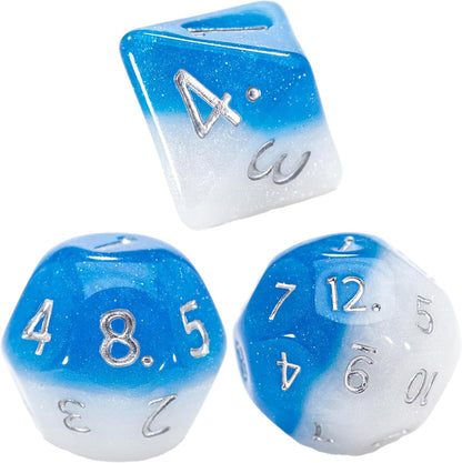 Three glittery blue and white gradient polyhedral dice with silver numbers