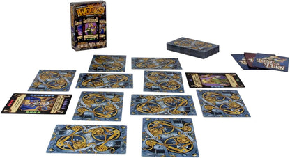 Castle Wulfenbach: The Works card game set up with box, deck, and multiple cards displaying gears and characters