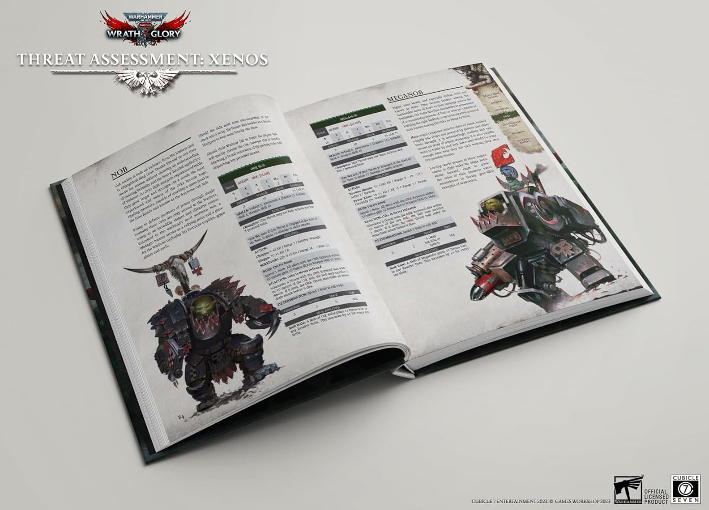 An open Warhammer 40k RPG rulebook showing detailed illustrations of an Ork Nob and an Ork Meganob, with text