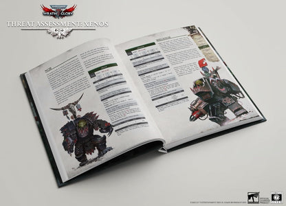 An open Warhammer 40k RPG rulebook showing detailed illustrations of an Ork Nob and an Ork Meganob, with text