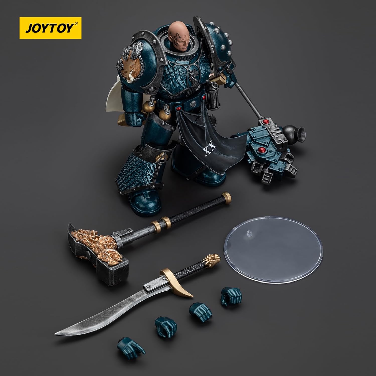 JOYTOY Warhammer 40k Alpha Legion action figure in teal armor, holding a heavy bolter, with extra sword, hammer, and hands