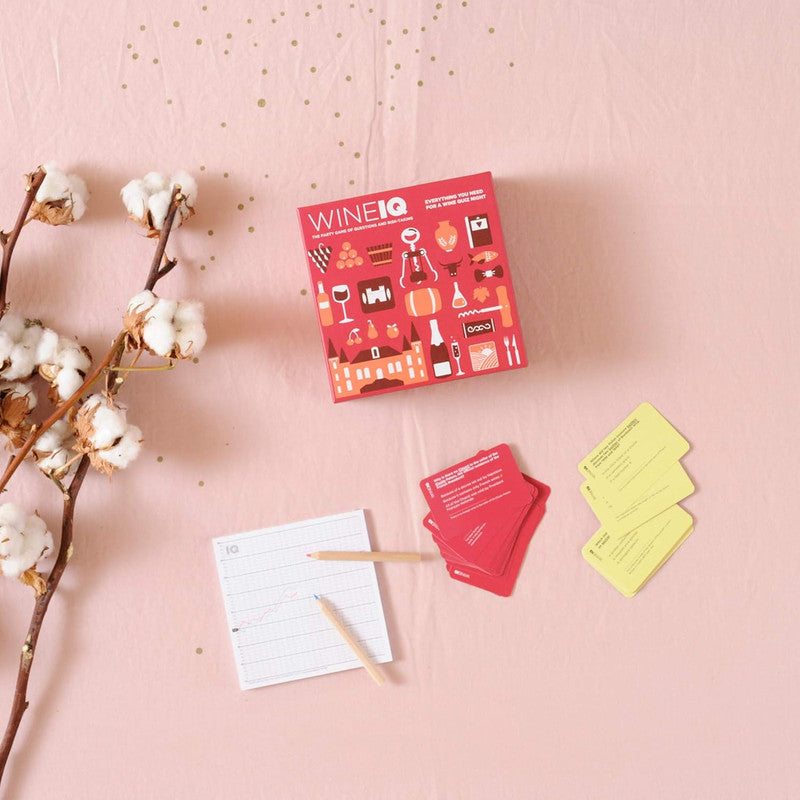 Wine IQ trivia game box set with red and yellow question cards and scoring notepad