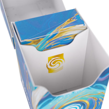 Open deck box with blue and gold swirl pattern, holding a stack of cards and displaying a gold foil logo