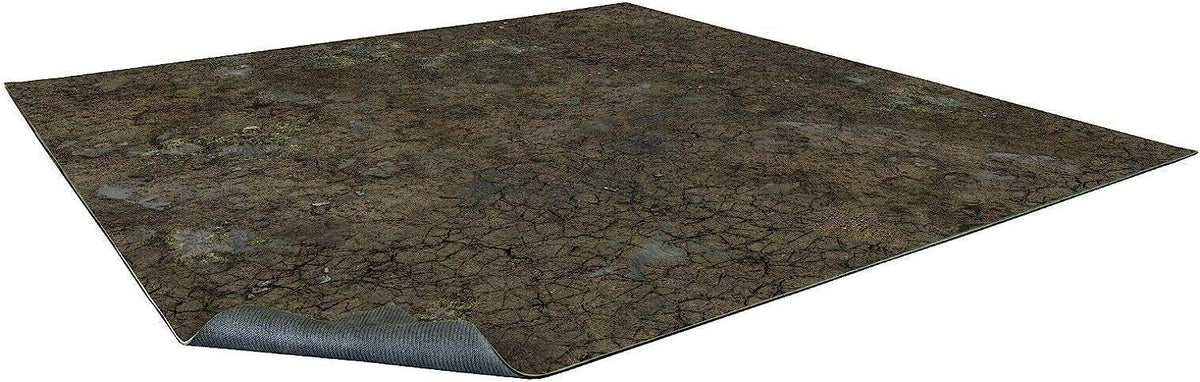 A rectangular battle mat with a cracked, muddy terrain design. A corner curls, revealing its dark, textured underside.