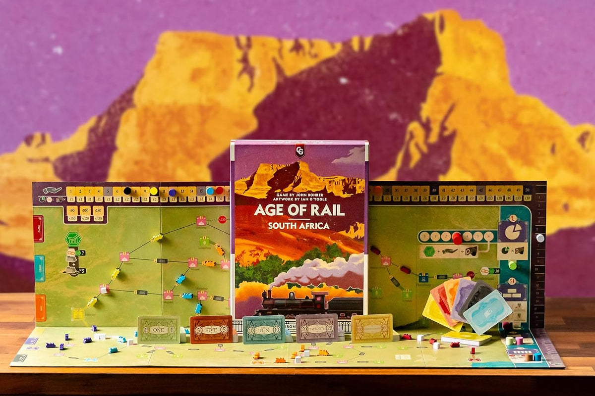 The board game &quot;Age of Rail South Africa&quot; displayed with its upright box, unfolded game board, and various game pieces
