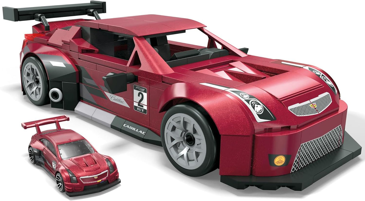 A large metallic red brick-built Cadillac GT race car model with a smaller matching die-cast car.