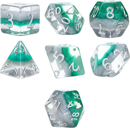 Seven green, gray, and clear swirled polyhedral dice with silver numbers scattered on a white background
