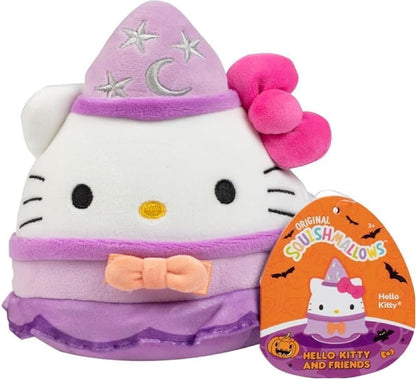 Hello Kitty Squishmallow plush wearing a purple witch hat, pink bow and dress, with the product tag visible