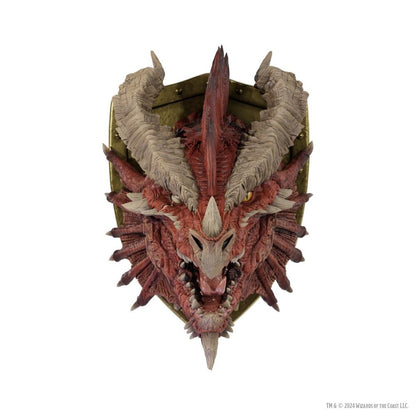 Red dragon head trophy mounted on a gold shield, featuring massive horns, fangs, and yellow eyes