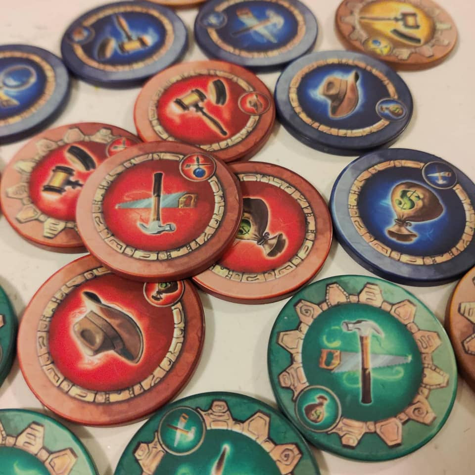 Close-up of Worldshapers Games Curators Chips add-on set, showing colorful round gaming tokens arranged on a board