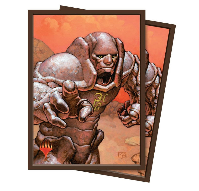 Pair of Magic: The Gathering card sleeves showing a roaring stone elemental with glowing green eyes, reaching forward, set against an orange rocky landscape
