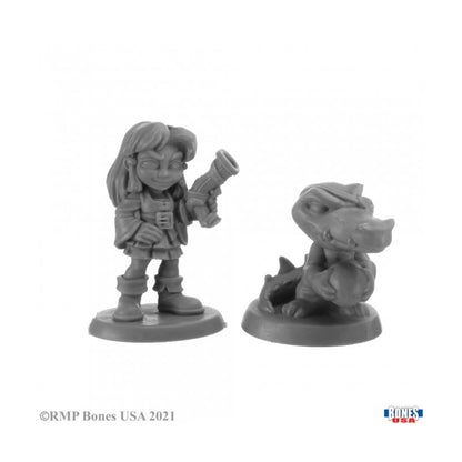 Unpainted fantasy miniature set: Female gnome pirate holding a blunderbuss and her baby alligator companion