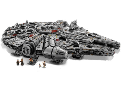 Detailed gray LEGO Millennium Falcon set with several Star Wars minifigures standing below the hull
