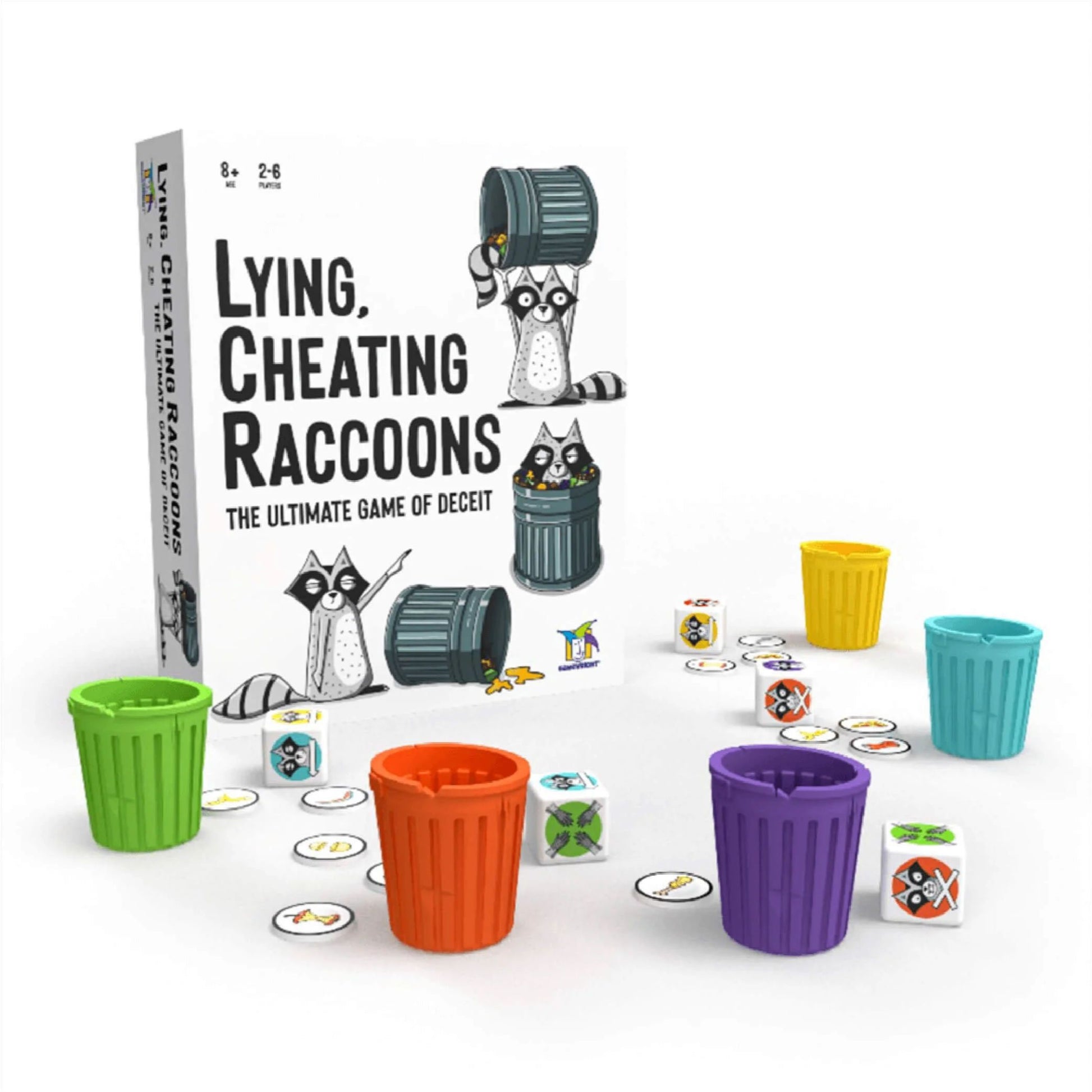 A Lying Cheating Raccoons game box stands behind colorful miniature trash cans, dice, and tokens spread on a white surface