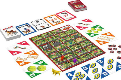 The Up Dog board game laid out with its playing board, multiple decks of cards, paw print tokens, and dog-shaped playing pieces