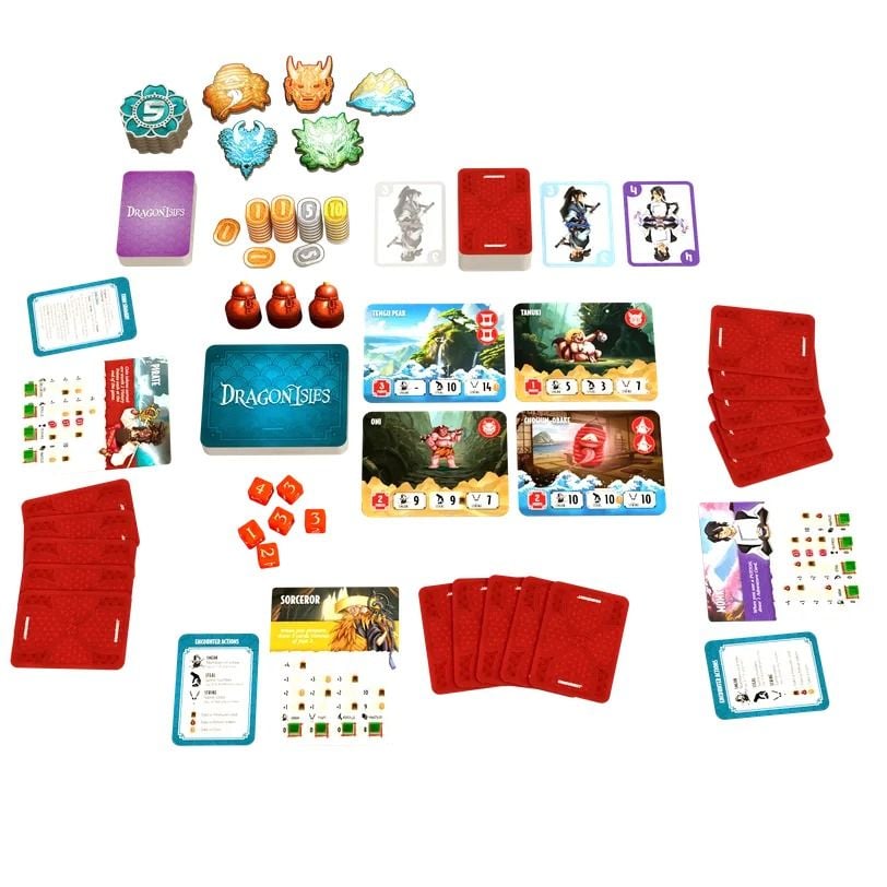 This Dragonisles board game component layout shows the blue title card, numerous red card decks, diverse illustrated monster and character cards, and various wooden tokens
