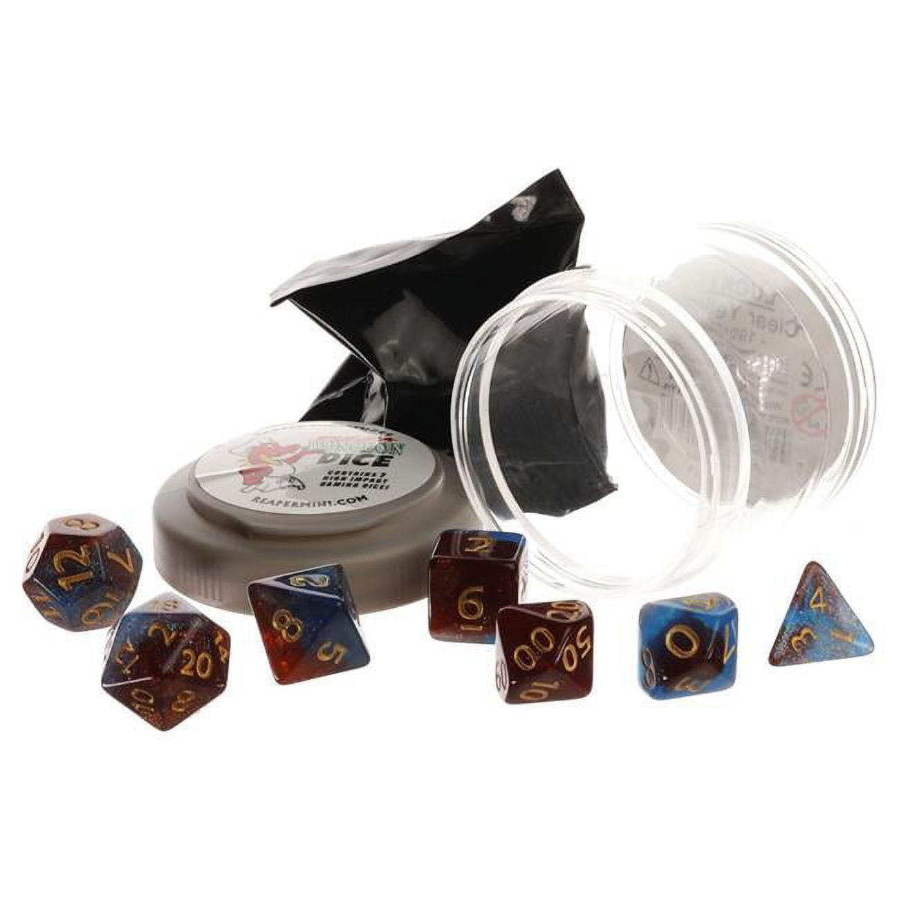 Seven red and blue nebula polyhedral dice with gold numbers are scattered around a gray container and clear plastic packaging