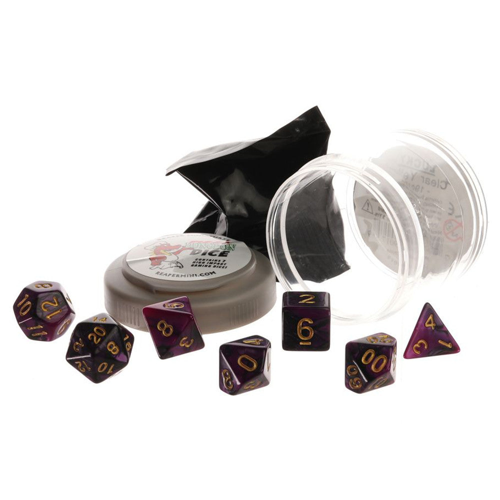 Seven purple and black polyhedral dice with gold numbers, scattered around a black bag, a clear container, and a gray round Dungeon Dice container