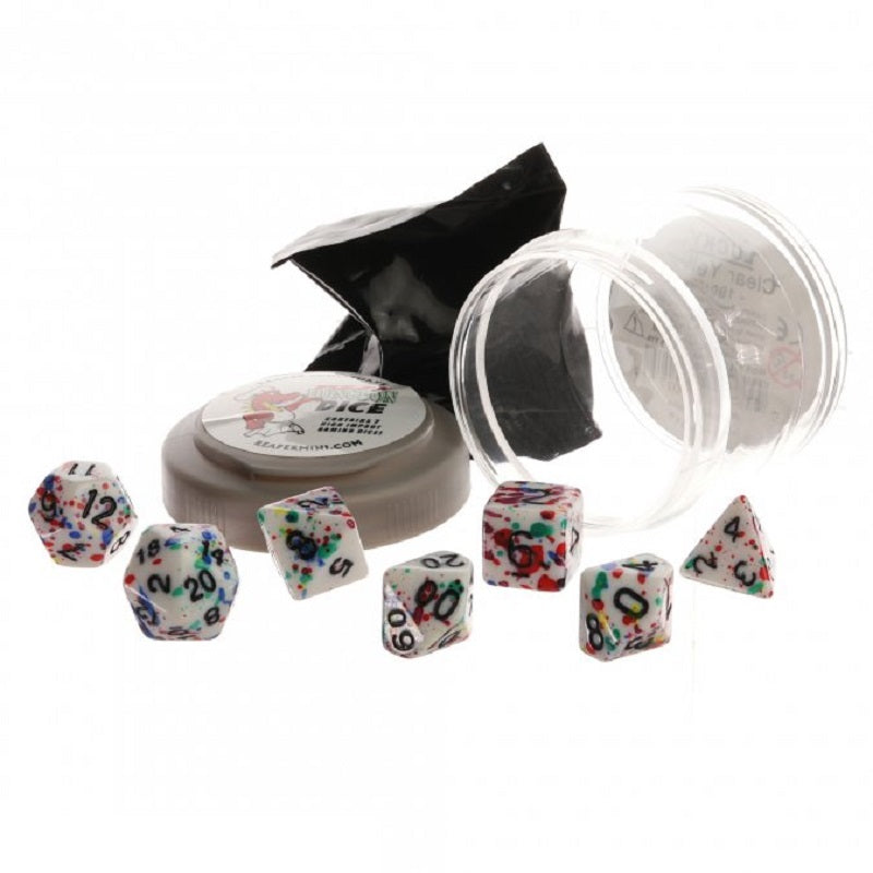 A set of white Reaper Pizza Dungeon Dice with rainbow paint splatters, an open clear container, a gray tin, and a black bag on white