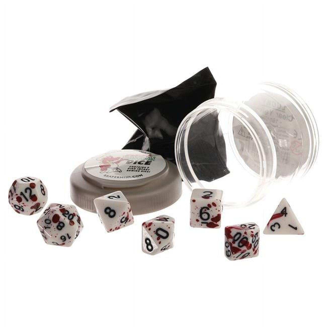 White polyhedral dice with red blood splatter are scattered around a clear plastic tube, a grey container, and a black bag