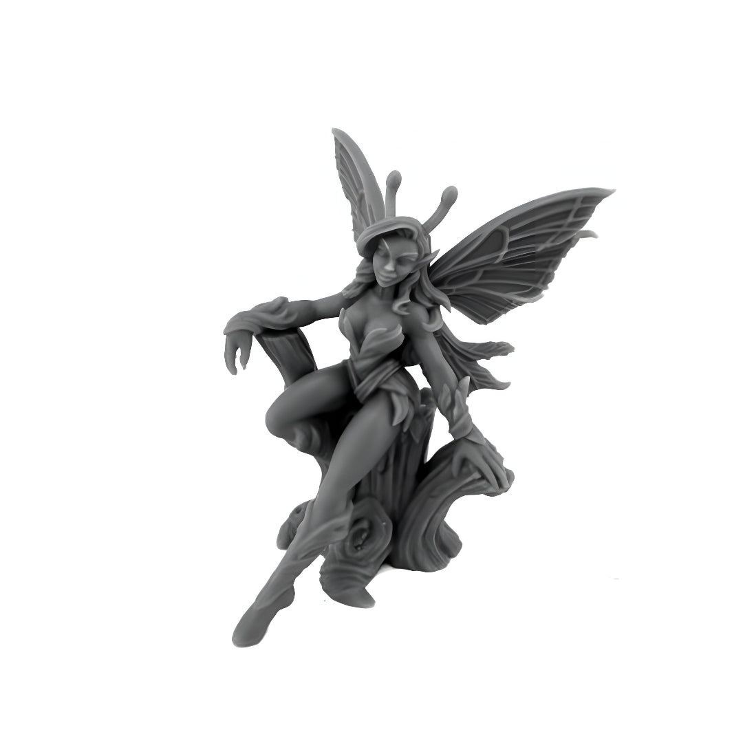 Fantasy fairy nymph miniature with wings and antennae, seated on a sculpted wood base