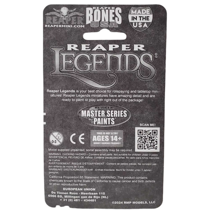 Dark gray back of a Reaper Legends Bones USA miniature package showing "AGES 14+" rating, choking hazard warnings, and a QR code, intended for a fantasy character like Durok, Dwarf Ranger