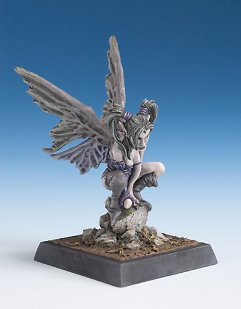 Painted fantasy miniature of a crouching dark fairy or sylph with large tattered grey wings, resting on a stone base